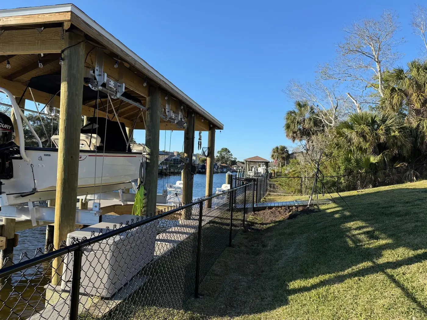 Black chain-link fence near dock