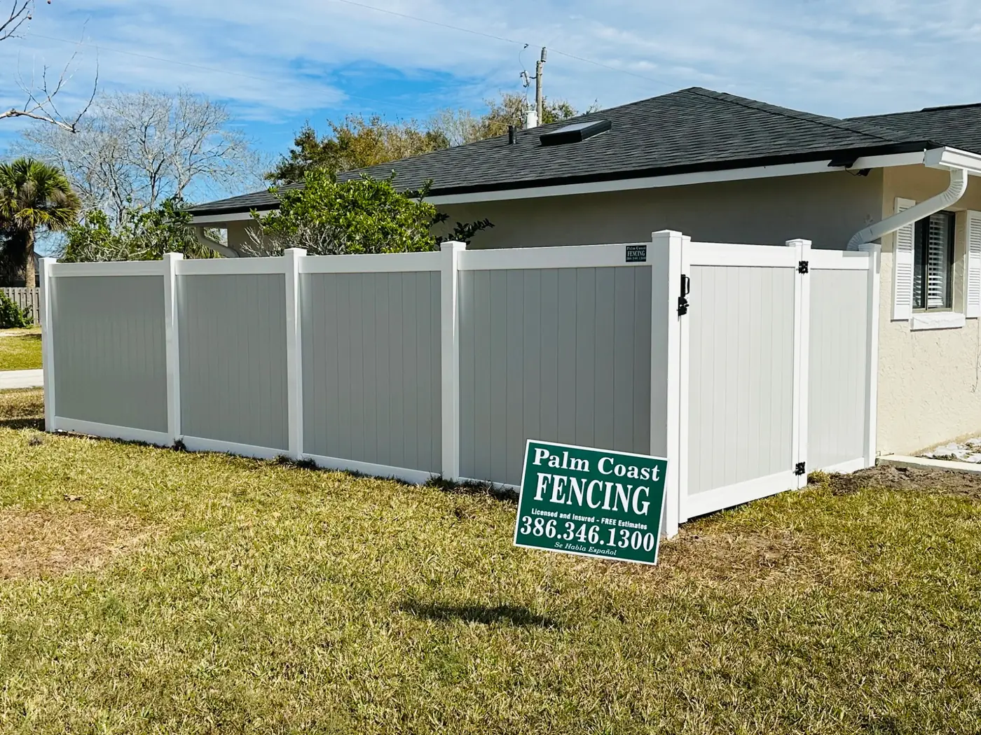 Grey vinyl privacy fence