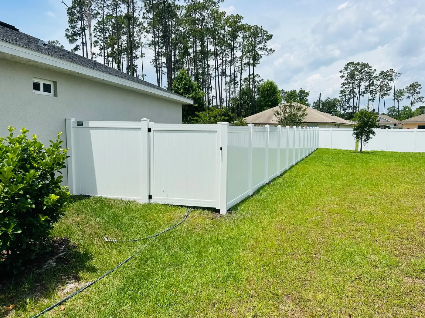 White vinyl privacy fence installation