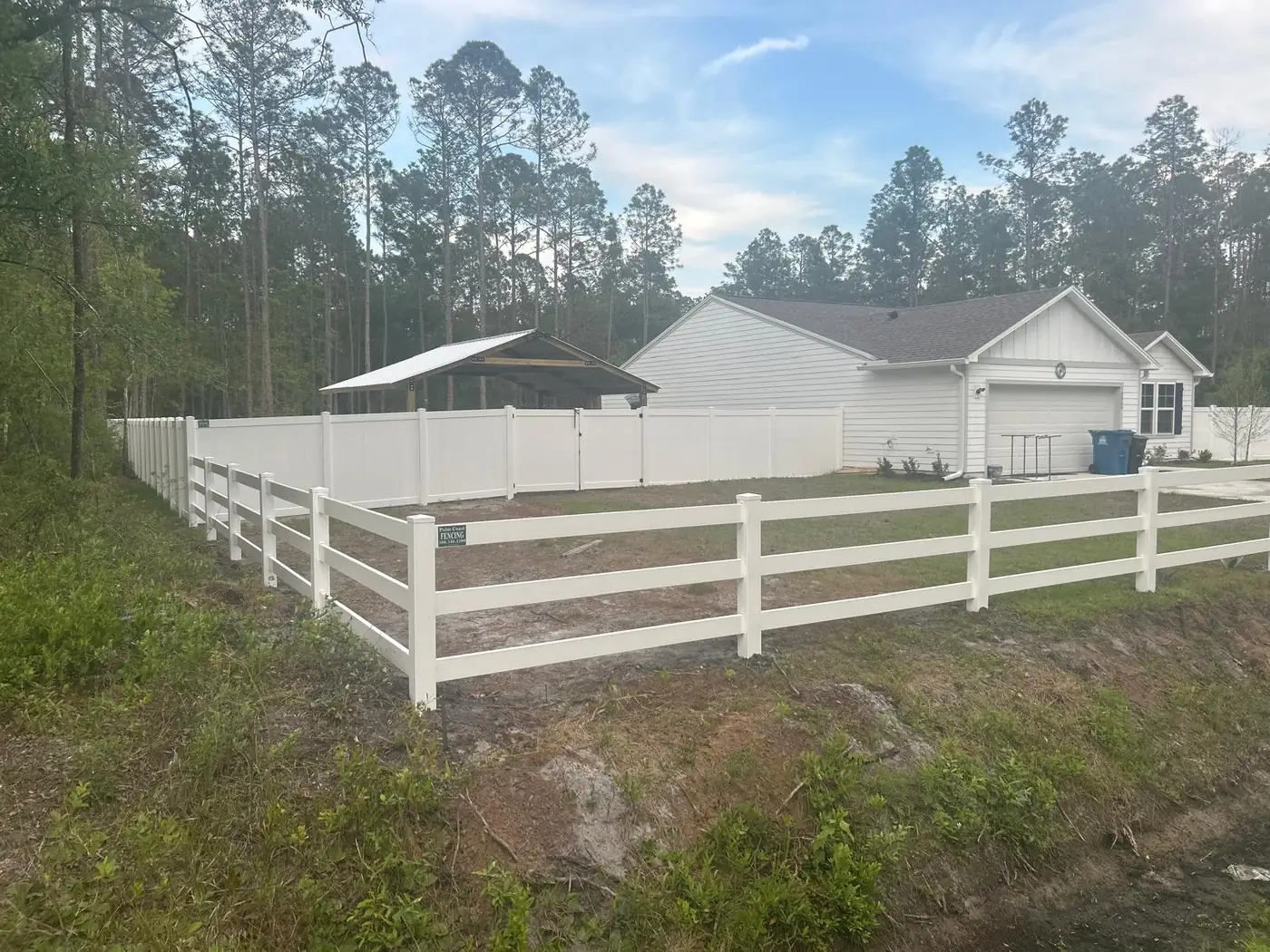 White ranch rail and privacy fence